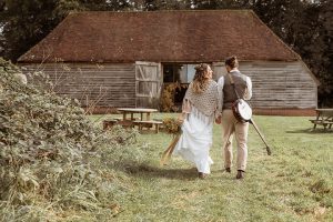 Rustic barn wdding, bride and groom walking away