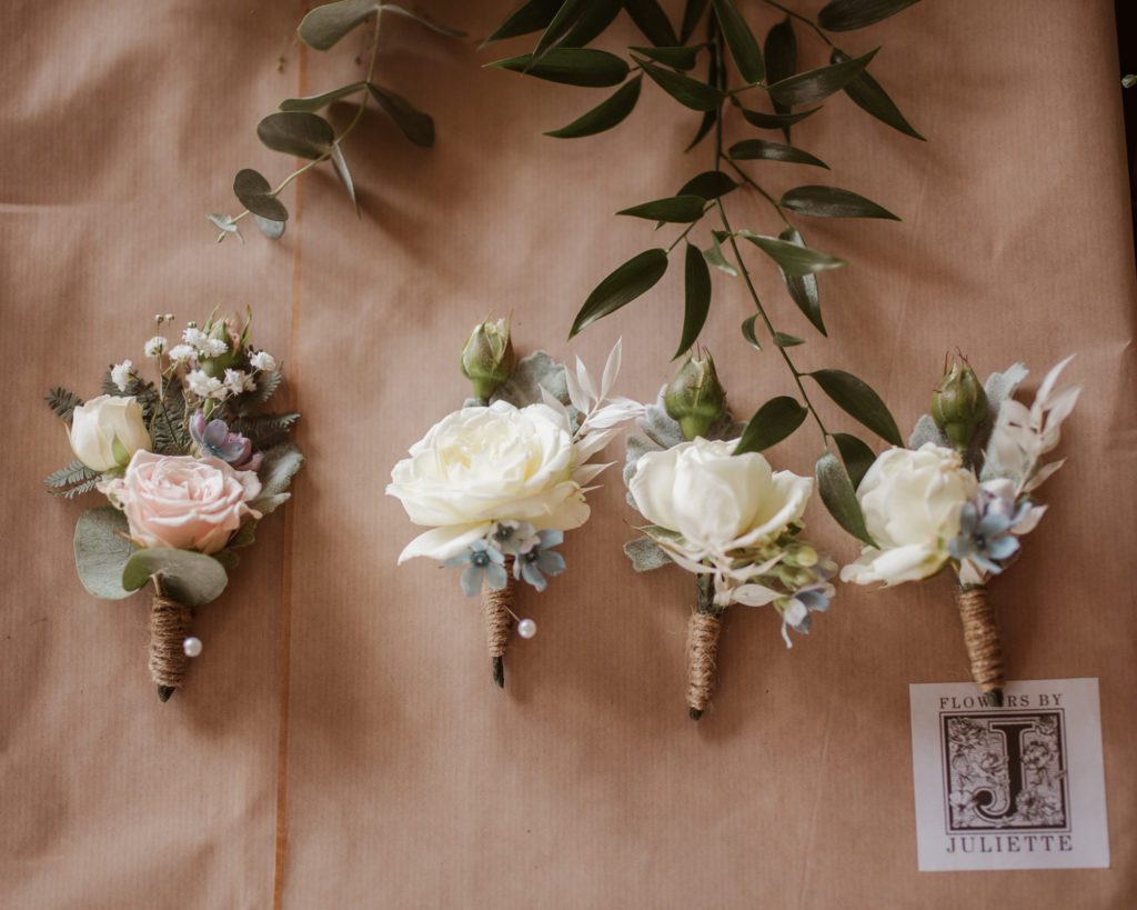 wedding buttonholes lined up