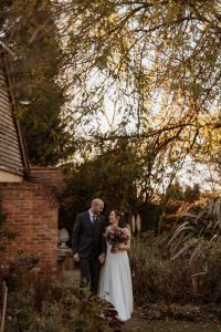 Rivervale Barn wedding bride and groom walking and smiling