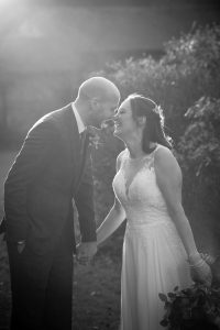 Rivervale Barn wedding bride and groom laughing B&W